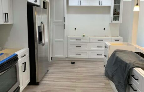 kitchenwestpalm Chic kitchen renovation showcasing subway tiles and elegant finishes.